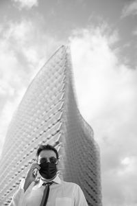 Low angle view of tower against cloudy sky