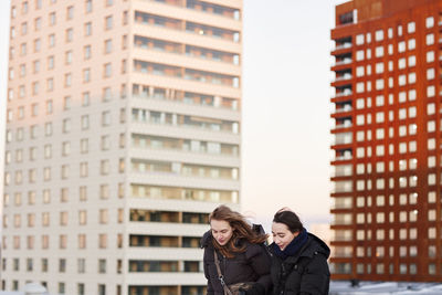 Female couple in modern neighborhood