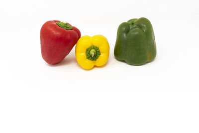 Close-up of bell peppers against white background