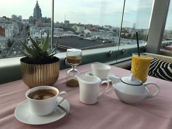 Coffee and cups on table