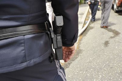 Midsection of man standing on road