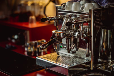 Close-up of coffee maker in cafe
