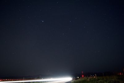 Illuminated road at night