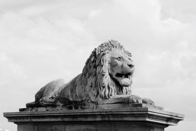 Low angle view of a statue against sky at the széchenyi lánchíd in budapest