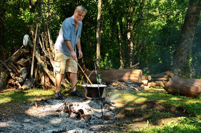 Portrait of man working in forest