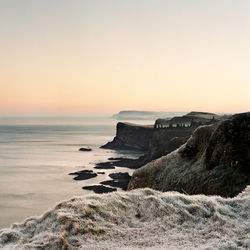 Scenic view of sea against clear sky during sunset