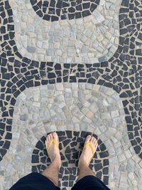 Standing on the ipanema beach cobblestone pattern