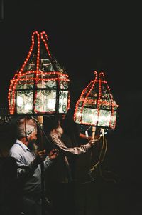 Illuminated carousel at night