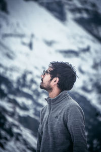 Portrait of young man standing outdoors