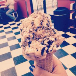 Close-up of hand holding ice cream