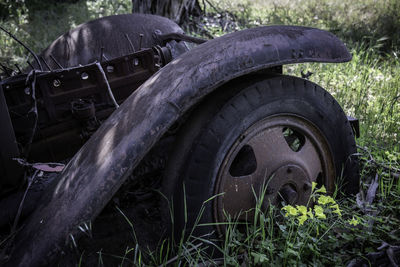 Abandoned car on field