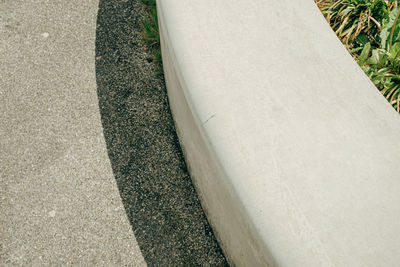 View from above on curved concrete bench