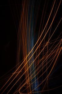 Close-up of light trails against sky at night