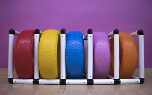 Close-up of colored pencils on table against blue background