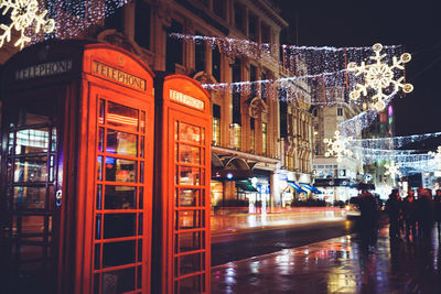 Reflection of illuminated buildings in city at night