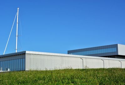 Low angle view of building against clear blue sky