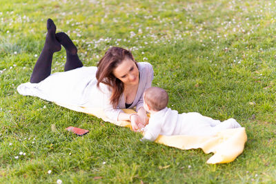 Woman lying on field
