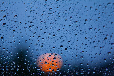 Full frame shot of raindrops on glass window