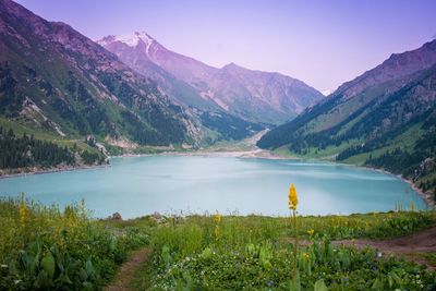 Scenic view of lake and mountains against sky