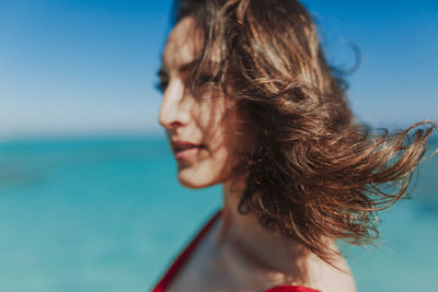 Portrait of woman against sky