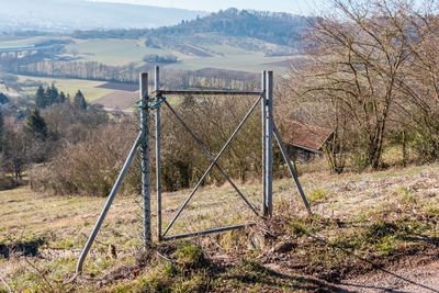 Scenic view of field seen through fence