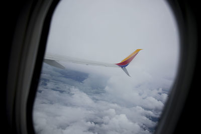 Close-up of kite flying against sky