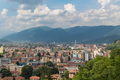 High angle view of townscape against mountains