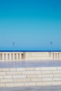 Retaining wall against clear blue sky