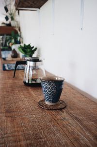Close-up of coffee cup on table