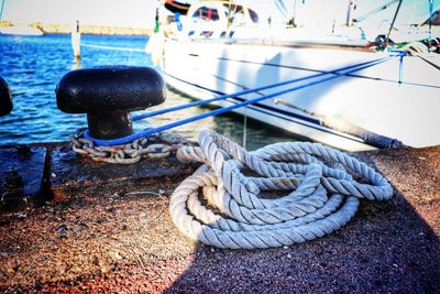 Close-up of rope tied to bollard