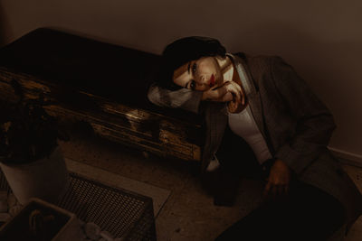 Young man sitting at home
