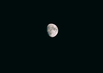 Low angle view of moon against sky at night