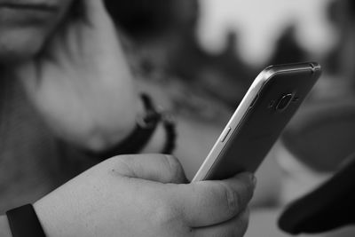 Close-up of person holding mobile phone