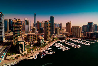 High angle view of buildings by river in city