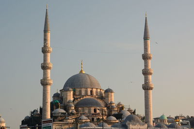 View of mosque against sky in city
