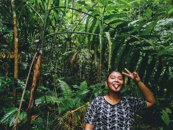 Portrait of a smiling young man in forest