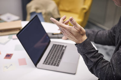 Businessman using laptop in office