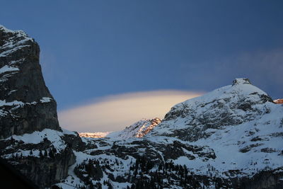 Scenic view of snowcapped mountains against clear sky