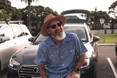 Portrait of smiling man in car