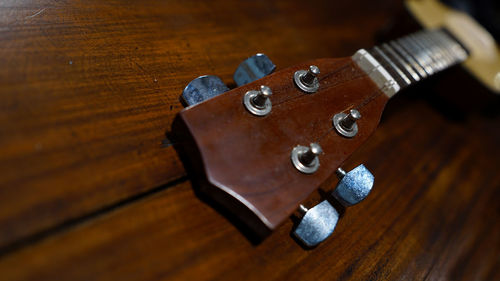 High angle view of guitar on table