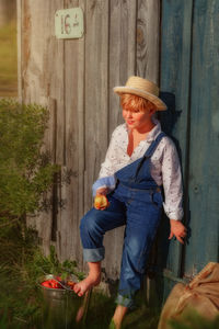 Full length of a man holding ice cream cone outdoors