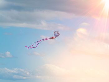 Low angle view of kite flying against sky