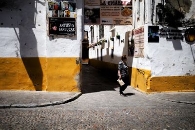 Man walking on street in city