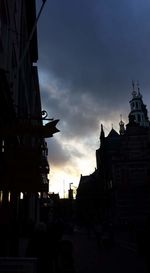 Low angle view of buildings against sky at sunset