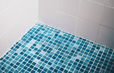 High angle view of tiled floor in bathroom