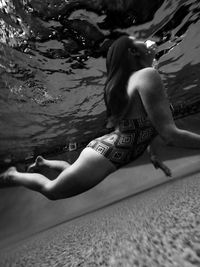 Full length of a woman swimming pool