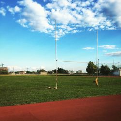 View of fields against blue sky