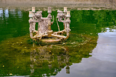 High angle view of wooden post in lake