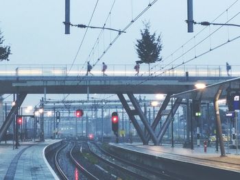 Train on railroad tracks against clear sky