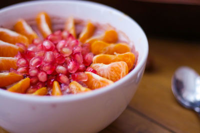 High angle view of chopped fruits in bowl on table